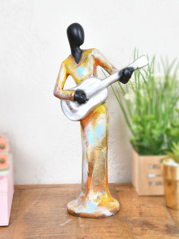 The Home Story Statue With Guitar
